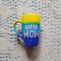 A Gradient colored mug (Yellow blue and ultramarine) with the words "Super Mom" with pink dots scattered all over