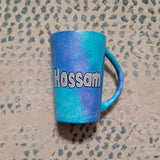 A blue Galaxy hand Painted mug with the name 