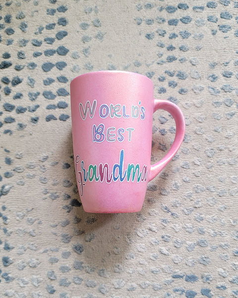 A Shimmery pink mug with the words "Worlds Best Grandma"