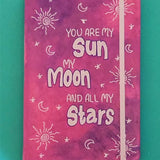 A Pink Galaxy Hand painted Notebook with the sentence 