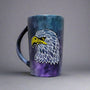 a black galaxy hand painted mug with an eagle design on it in zentangles of greys