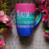 A gradient colored mug (from top fushia then green then blue) with the name sally wirten and then a white line underneath it and then the words Noun in brackets and below it 