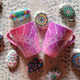 2 hand-painted Pink Galaxy Mugs with a quarter mandala drawn on each at the corner