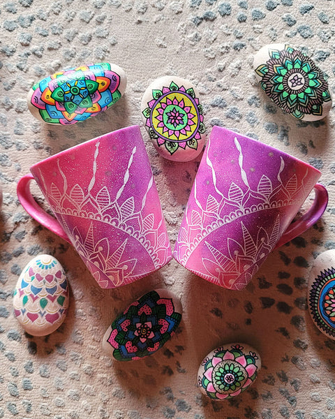 2 hand-painted Pink Galaxy Mugs with a quarter mandala drawn on each at the corner