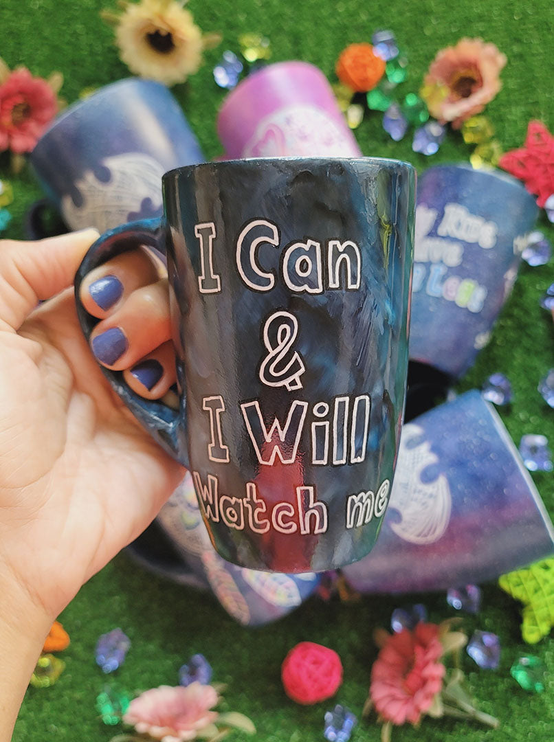 A mix colored mug (black grey and blue) with the words "I can and I will watch me"