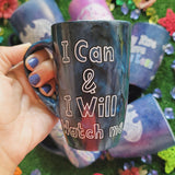 A mix colored mug (black grey and blue) with the words 