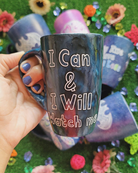 A mix colored mug (black grey and blue) with the words "I can and I will watch me"