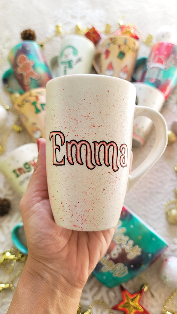 A Pearl white hand painted mug with the name "Emma"