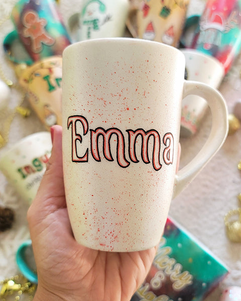 A Pearl white hand painted mug with the name "Emma"