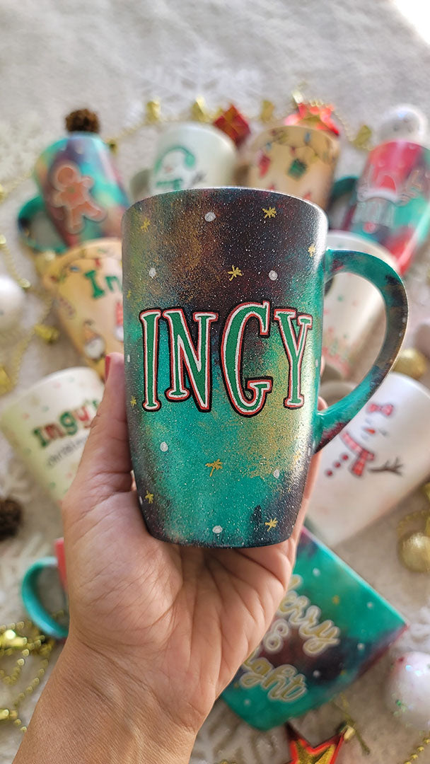 A Christmas hand painted mug with the name "Ingy"