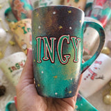 A Christmas hand painted mug with the name 