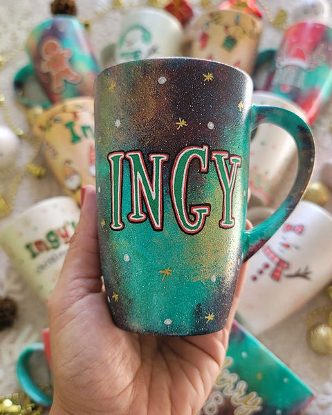 A Christmas hand painted mug with the name "Ingy"