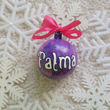 A Purple hand painted ornament with the name 