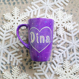 A Purple Galaxy hand-painted mug with a heart painted and the name 