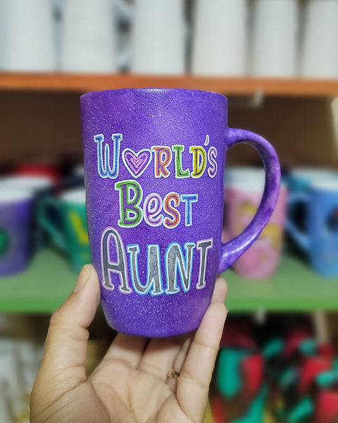 A Purple galaxy hand painted mug with the words "Worlds Best Aunt"