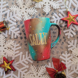 A Christmas galaxy colored hand painted mug with the name 