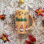 A Gold hand painted mug with gnomes all around the bottom half of the mug and festive lighting all over the top of the mug and the name nadodo in the center