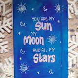 A Blue Galaxy Hand painted Notebook with the sentence 