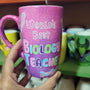 A Pink Galaxy hand painted mug with the words " worlds best biology teacher" and biology items scattered all over (DNA, Plant cell, microscope...etc.)