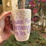 A white pearl hand painted mug with the words 