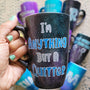 A Black galaxy hand painted mug with the sentence "I'm Anything but a quitter"