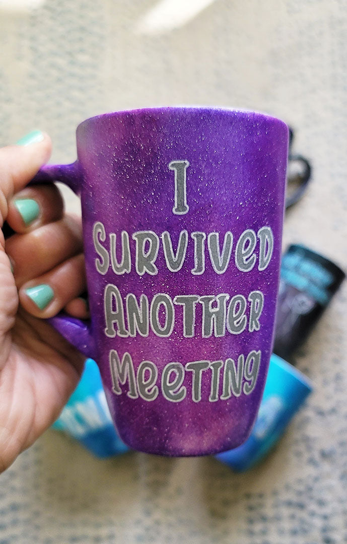 A Purple Galaxy hand painted mug with the words "I survived another Meeting"