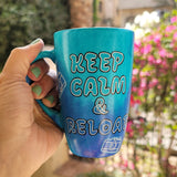 A Blue hand painted mug with the words 