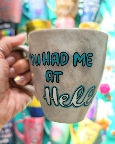 A hand-painted taupe silver mug with the words "You had me at hello"