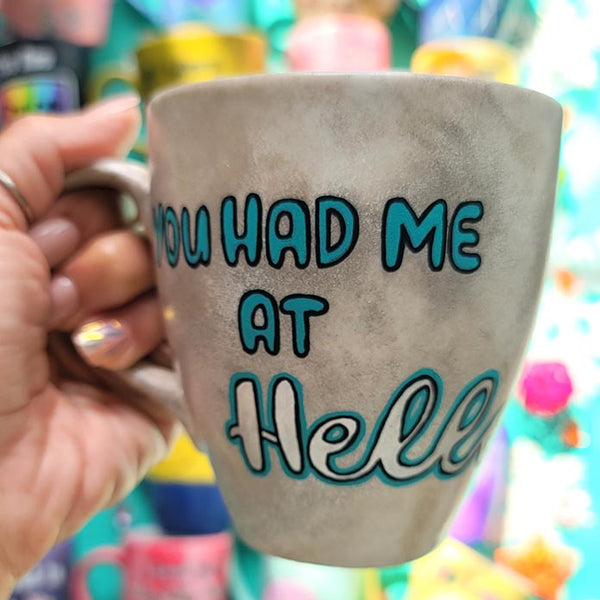 A hand-painted taupe silver mug with the words "You had me at hello"