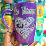 A Hand-Painted Purple galaxy mug with the words 