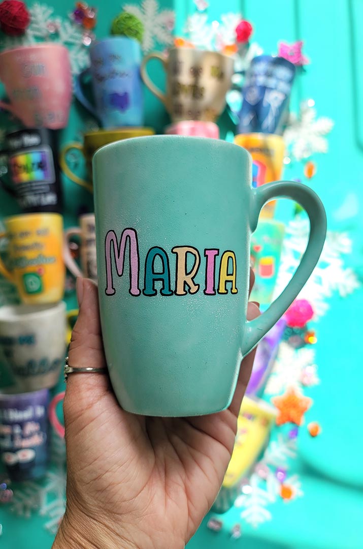 A Pastel green Hand-painted mug with the name "Maria"