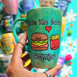 A hand-painted green galaxy mug with the words 