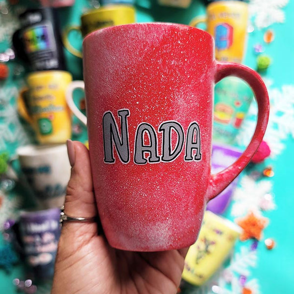 A hand-painted red galaxy mug with the name "Nada"