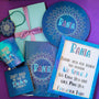 A Gift Set of a mug, notebook, Coaster, MDf plate, wood Frame, tree Necklace and Card both hand painted in blue galaxy color and have the sentence "don't make me use my teacher voice" and name Rania