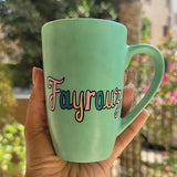 A Hand painted green Mug with the name 