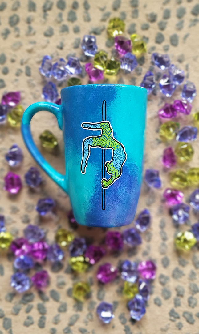 A Blue Hand painted Mug with a design for a pole dancer on a pole in patterns