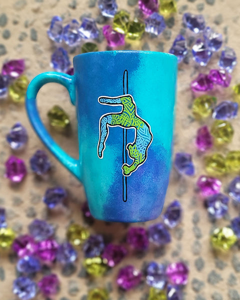 A Blue Hand painted Mug with a design for a pole dancer on a pole in patterns