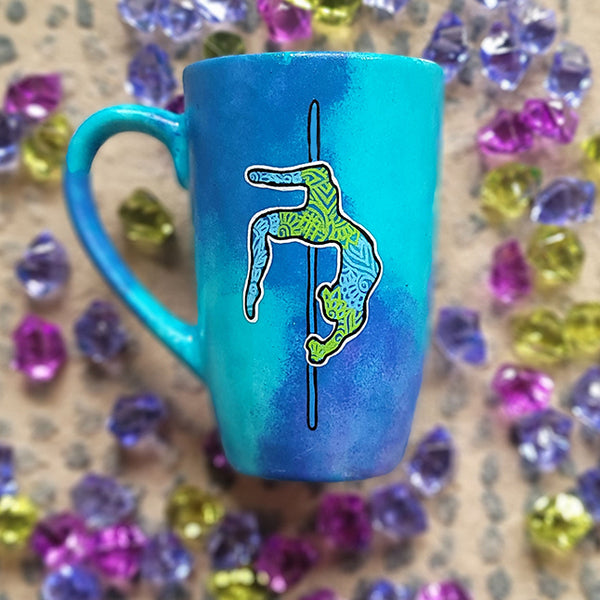 A Blue Hand painted Mug with a design for a pole dancer on a pole in patterns