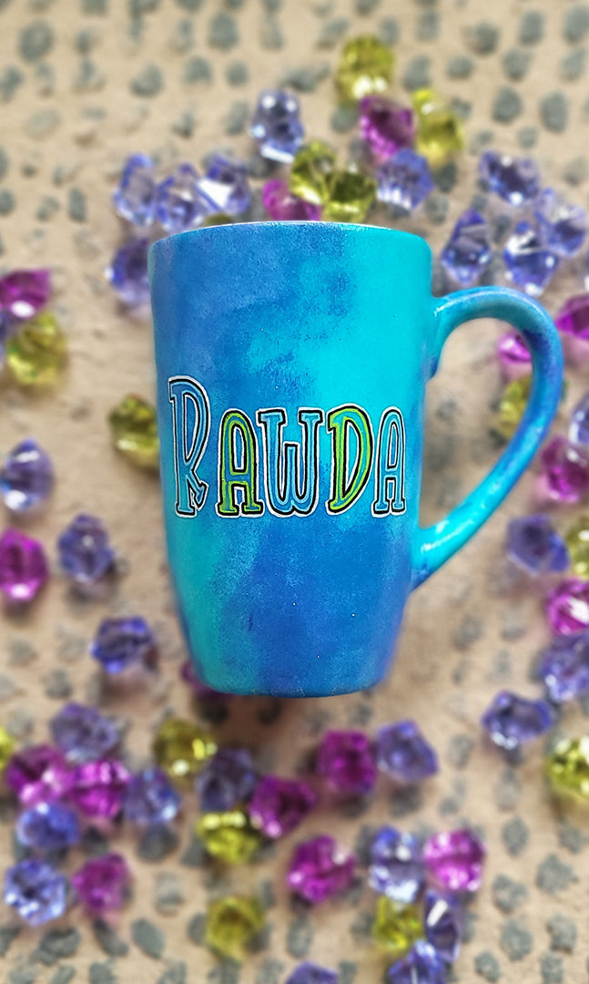 A Blue hand painted mug with the name rawda