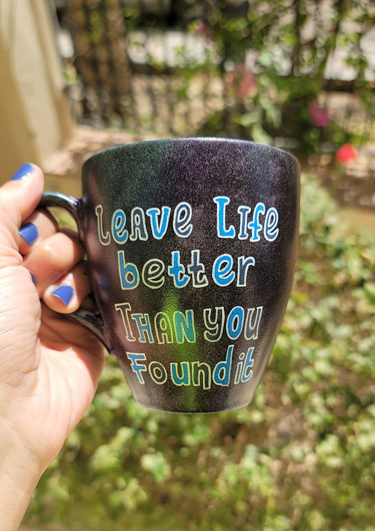 A Dark sky mug with the words "Leave life better than you found it "