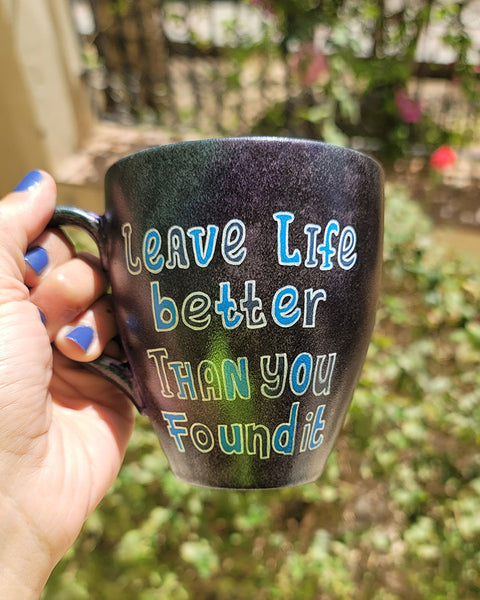 A Dark sky mug with the words "Leave life better than you found it "