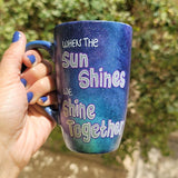 A Black Galaxy hand painted mug with the sentence 