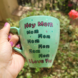 A mint Colored mug with the sentence 