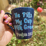 a Bluish galaxy hand painted mug with the words 