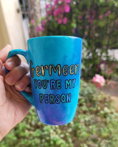 A Hand painted blue mug with the words "Germeen, you're my person"