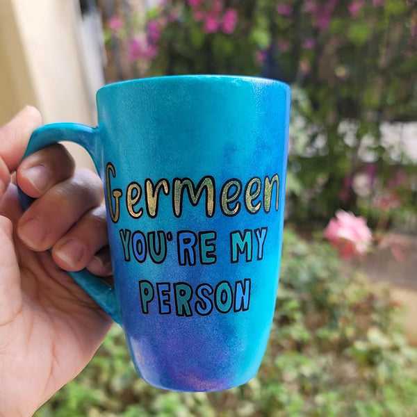 A Hand painted blue mug with the words "Germeen, you're my person"