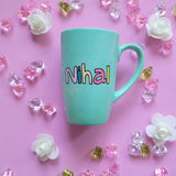 A Mint green hand painted mug with the name 