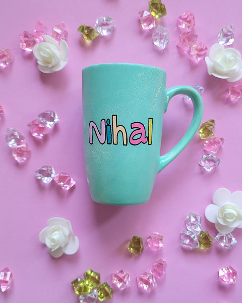 A Mint green hand painted mug with the name "Nihal"