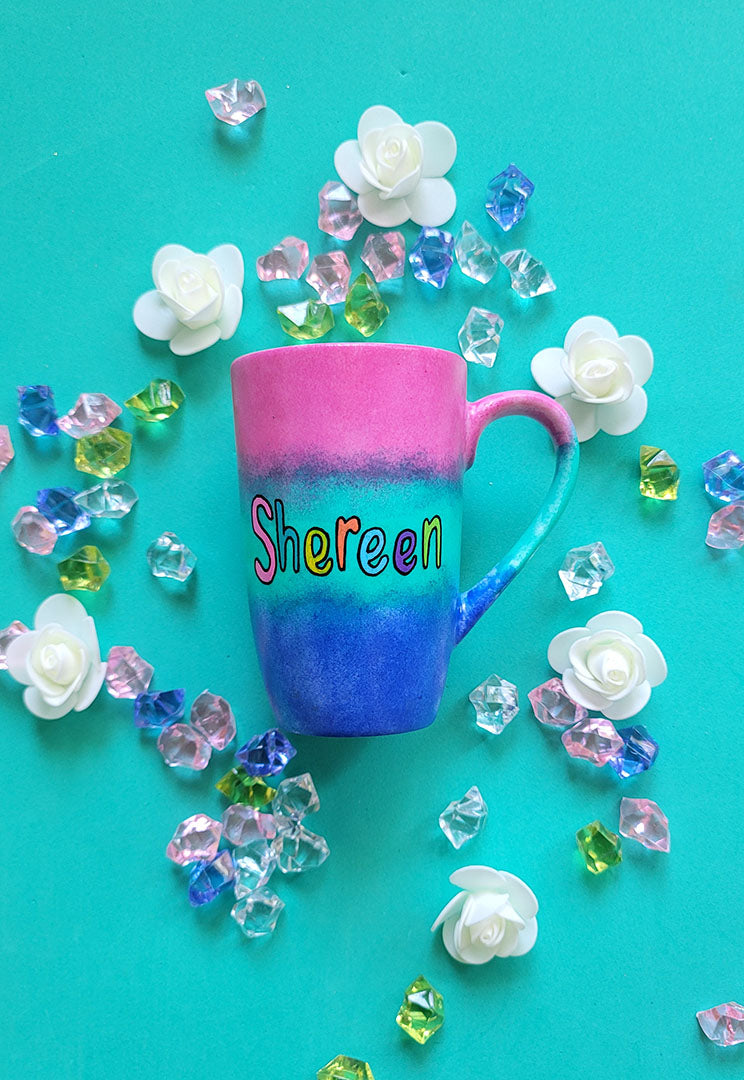 A Gradient hand painted mug (Pink Green and ultramarine) with the Name "Shereen"