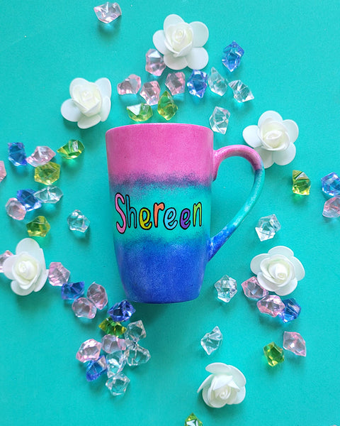 A Gradient hand painted mug (Pink Green and ultramarine) with the Name "Shereen"